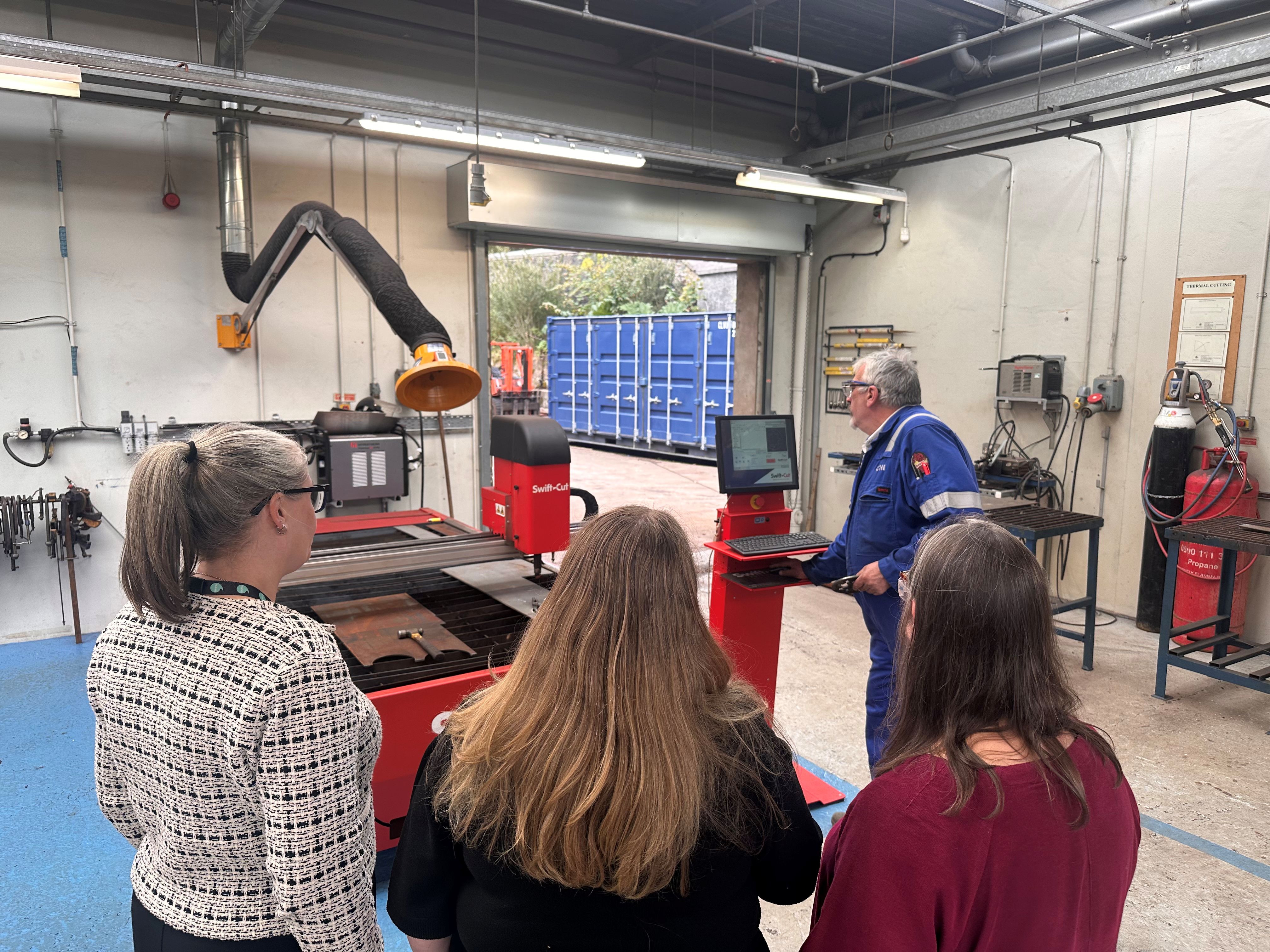 Islands Forum attendees taking tour of Tech and Innovation Centre