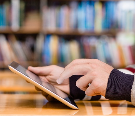 An individual using an iPad An individual using an iPad