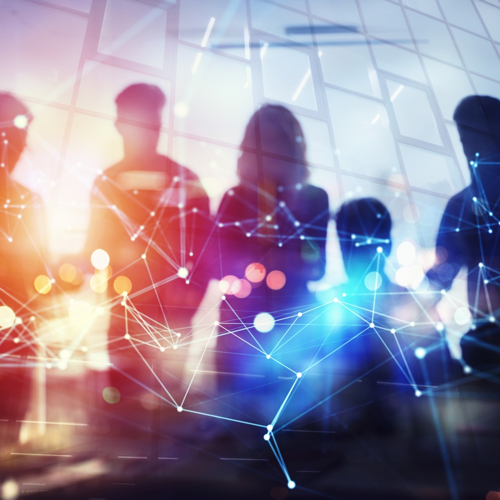 Silhouette of people with a network grid overlaid Silhouette of people with a network grid overlaid