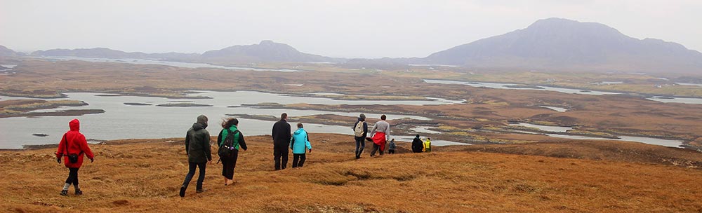 students walking across Western Isles moorland