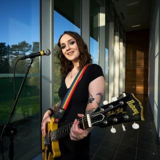 A person playing guitar A person playing guitar