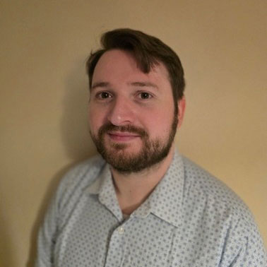 a student smiling at the camera a student smiling at the camera