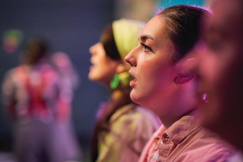 Close up of students during a performance rehearsal. Close up of students during a performance rehearsal.