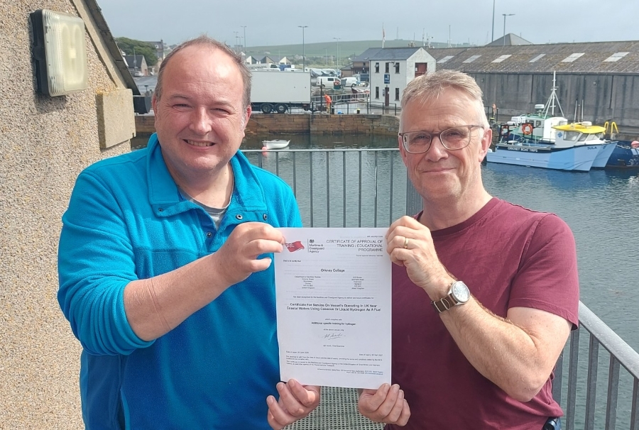 Mark Shiner and Jon Clipsham holding UK Government Maritime and Coastguard Agency recognition certificate