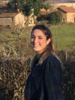 Woman facing the camera, smiling