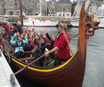 Summer course participants sailing on a replica Viking ship in Shetland Summer course participants sailing on a replica Viking ship in Shetland