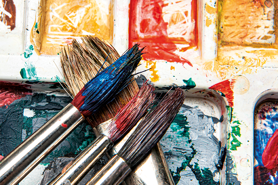 Paintbrushes with paint on them Paintbrushes with paint on them