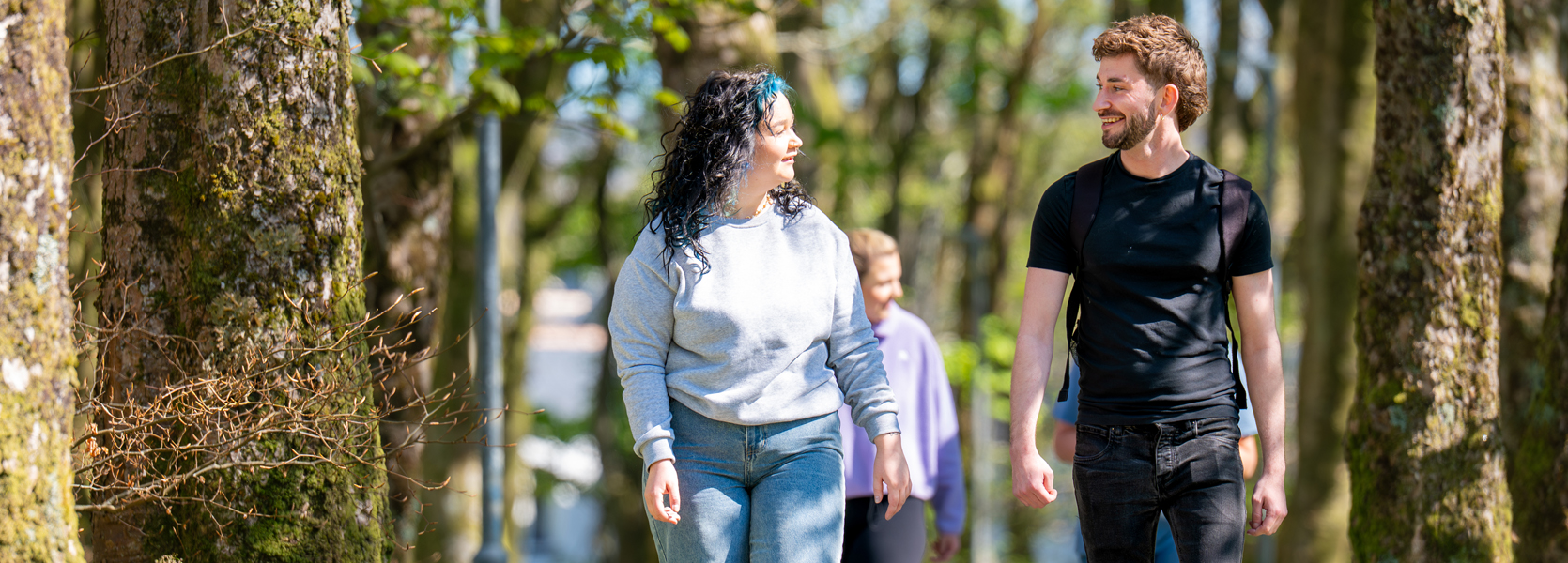 Two people talking and walking