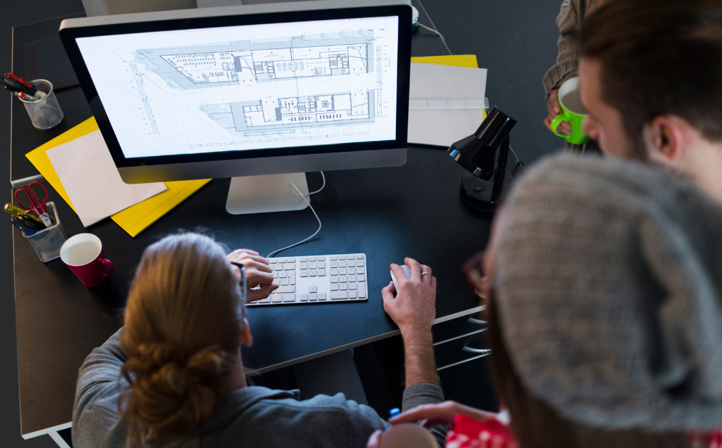 People working on design for a building People working on design for a building