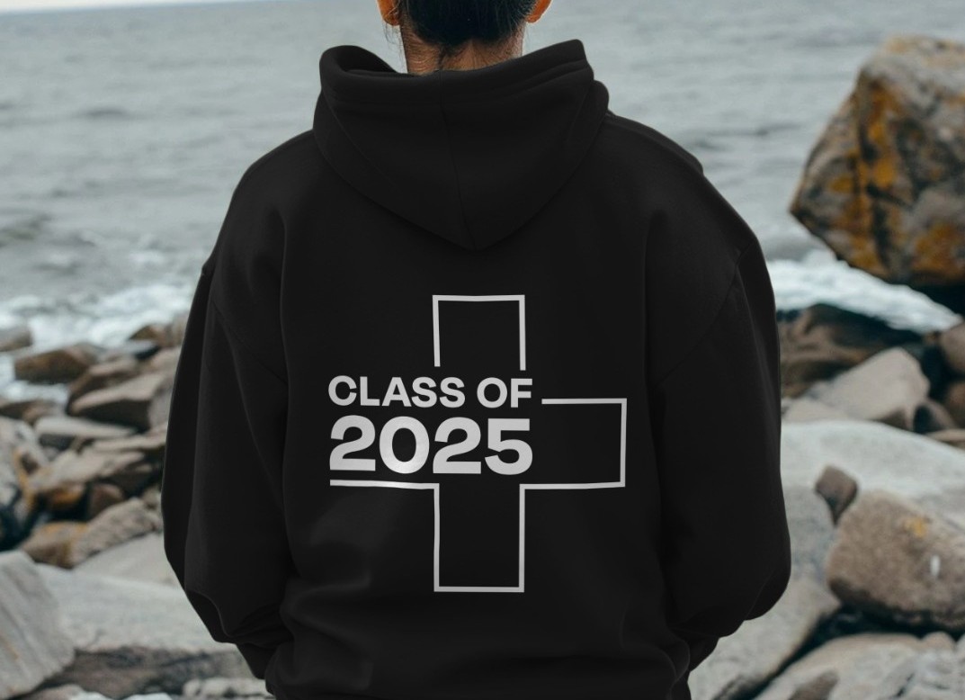 A person standing with their back to the camera and the UHI hoodie says 'Class of 2025 A person standing with their back to the camera and the UHI hoodie says 'Class of 2025